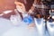 Barman mixes blue cocktail show with colorful alcoholic and smoke bar counter