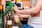 Barman pouring a draught beer at pub or bar