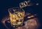 Barman pouring whiskey in the glass on wood table, warm atmosphere, old style