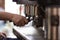 Barman prepares coffee with coffe machine