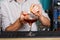 Barman`s hands making flaming cocktail