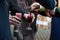 Barmen pouring wine into glasses for groom and guests at wedding