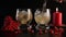 Barmen`s hand pouring ginger ale with drambuie into a glass full of ice, close-up. Still life isolated on black