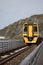 BARMOUTH, GWYNEDD UK - APRIL 09 : Train travelling over the viaduct in Barmouth, Gwynedd on April 09, 2023