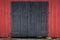 Barn door in black with a red wall around