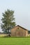 Barn in Farmfield by Tree