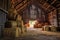 barn with hay bales stacked neatly inside