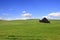 Barn in the middle of rolling hills