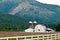 Barn Nestled in Forested Mountains