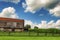 Barn Pasture and Cornfield under cloudy skies