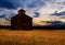 Barn silhouetted at sunset