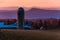 Barn and silo on a farm in the Shenandoah Valley at sunset, with