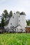 a barn with wheel fence