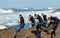 Barnacle fishermen work in Galicia in an area with lots of waves and underground sea