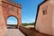 Barolo medieval castle entrance arch in red bricks, Italy