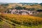 Barolo village view from the vineyard. Autumn landscape langhe nebbiolo vineyards hills. Viticulture Piedmont, Italy.