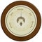 Barometer on dark wood