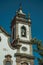 Baroque bell towers from church with whitewashed wall