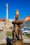 Baroque lion fountain, sculptural group of dancing children, Main square, old town, renaissance baroque historical buildings, Holy