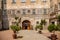Baroque romantic castle Nove mesto nad Metuji, renaissance chateau, courtyard, Wooden lattice overgrown with greenery, sunny day,