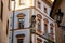 Baroque Tuscan palace at Square nearby Prague Castle in sunny day, view from Town hall stairs, facade is richly decorated with