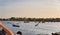 BARRA, GAMBIA, AFRICA - CIRCA MARCH, 2017: Ferry navigates through fisher boats on it\'s way to the harbor