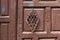 Barred viewing window in the ancient door