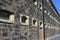 Barred windows on wall of prison