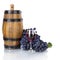 Barrel, bottles and glass of wine and ripe grapes