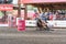 Barrel racing horse and rider gallop around barrel at stampede