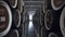 Barrels of cognac, wine or whiskey. Extract of brandy in oak barrels. Alcohol warehouse. Hundreds of barrels in an