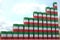 Barrels with flag of Kuwait form rising chart or upwards trend. Oil industry success concept, 3D rendering