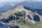 Barren crags of Corvo peak in Gran Sasso range from south-west aerial, Italy