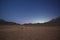 Barren desert landscape in hot climate at night