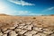 Barren expanse The cracked earth of a desert landscape, endless sky