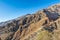 Barren mountain in Darband valley in autumn in the morning against blue sky in the Tochal mountain. A popular recreational region