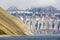 Barren mountains with snow remains seen in Spitsbergen