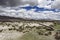 A barren plateau meadow below the mountain