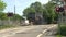 Barrier coming down at a level crossing.