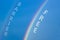 Barrier free symbol. Rainbow in the blue sky. Words Barrier free. Peaceful nature. Beautiful blue background. Diversity, inclusion