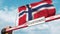 Barrier gate with CUSTOMS sign being closed with flag of Norway as a background. Norwegian Border closure or protective
