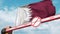 Barrier gate with STOP CORONAVIRUS sign being closed with flag of Qatar as a background. Qatari Quarantine