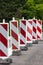 Barrier of red and white signs for marking road works