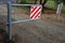 A barrier to dirt road consisting of two barriers that allow cyclists and pedestrians to enter. cars and, however, vehicles are li