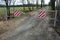 A barrier to dirt road consisting of two barriers that allow cyclists and pedestrians to enter. cars and, however, vehicles are li