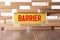 Barrier. Wooden letters on the office desk, informative and communication background