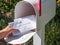 Barrington, IL/USA - 08/22/2020:  Homeowner receives applications for mail-in voting in home mailbox via US Postal Service