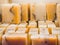 Bars of soap on a shop window. Orange soap with natural cedar oil and herbal ingredients. Handmade natural cold process soap. Eco-