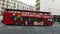 Barselona, Spain - December 2021: Red Double-decker Tourist Bus passes by. Traffic crosses the intersection in Barselona