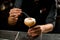 Bartender decorated the yellow creamy color alcoholic cocktail drink with a dried red pepper